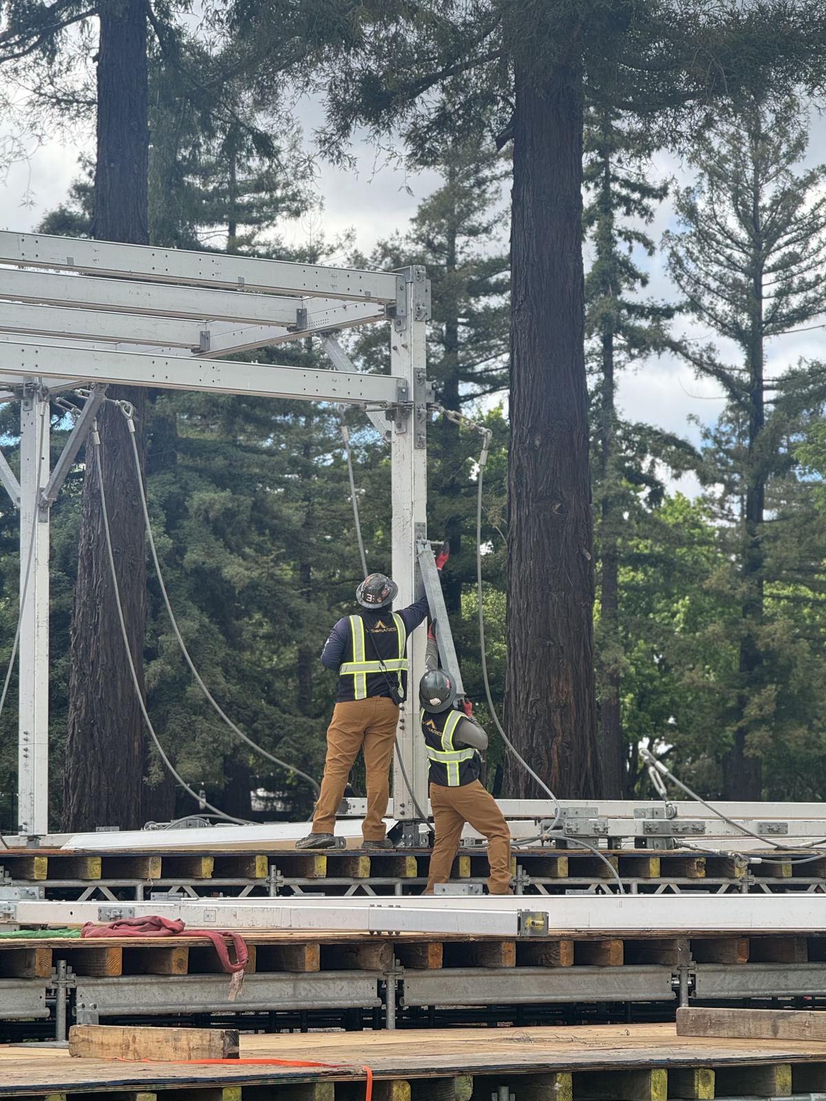 Crew member installing structure framing