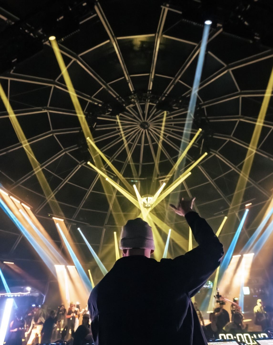 Lighting and crowd inside a large event structure